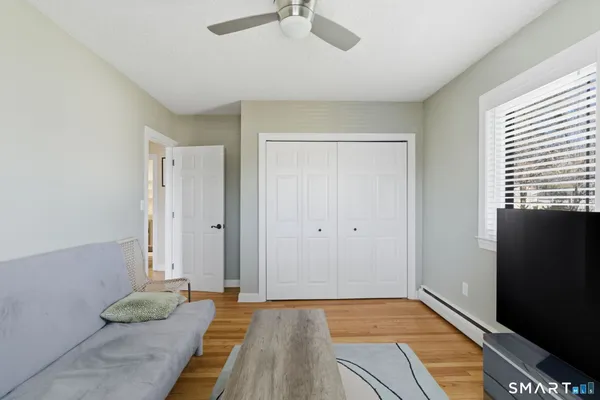 a view of room with window and hardwood floor