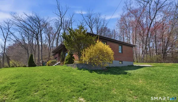 a backyard of a house with lots of green space