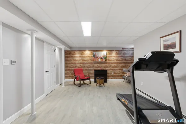a dining room with furniture and a rug