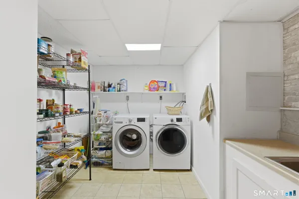 a kitchen with a sink cabinets and appliances