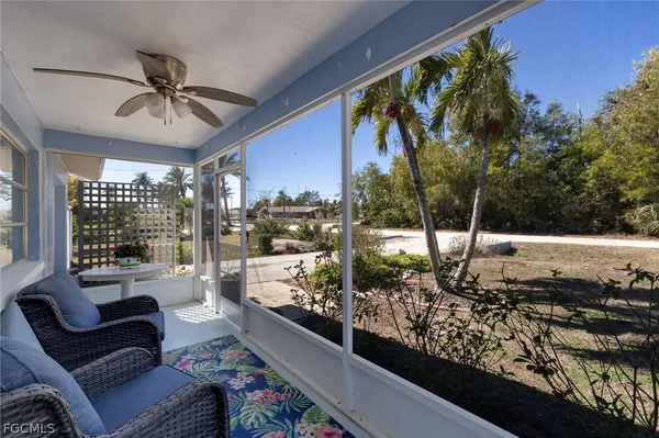 a outdoor living space with furniture and a potted plant
