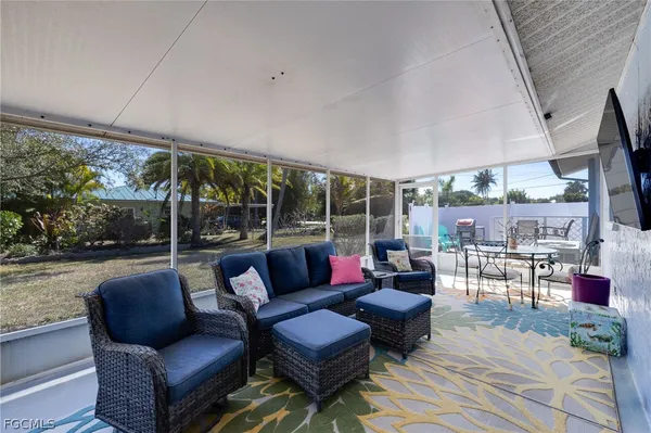 a outdoor living space with patio furniture and a potted plant