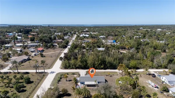 an aerial view of residential houses with city view