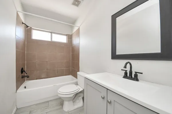 a view of bathroom with white walls