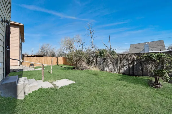 a view of a park with large trees