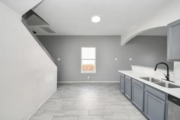 a kitchen with a sink and washing machine