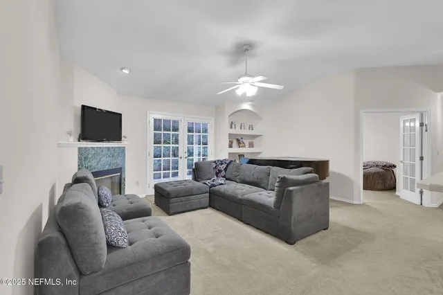 a living room with furniture and a fireplace
