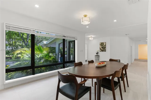 a view of a hallway with wooden floor and closet