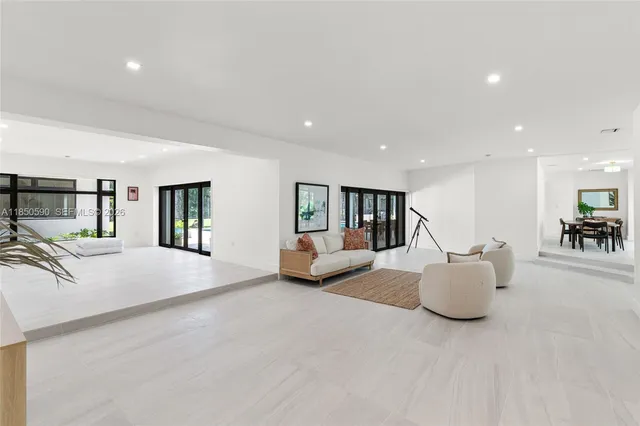 a view of backyard with green space and porch