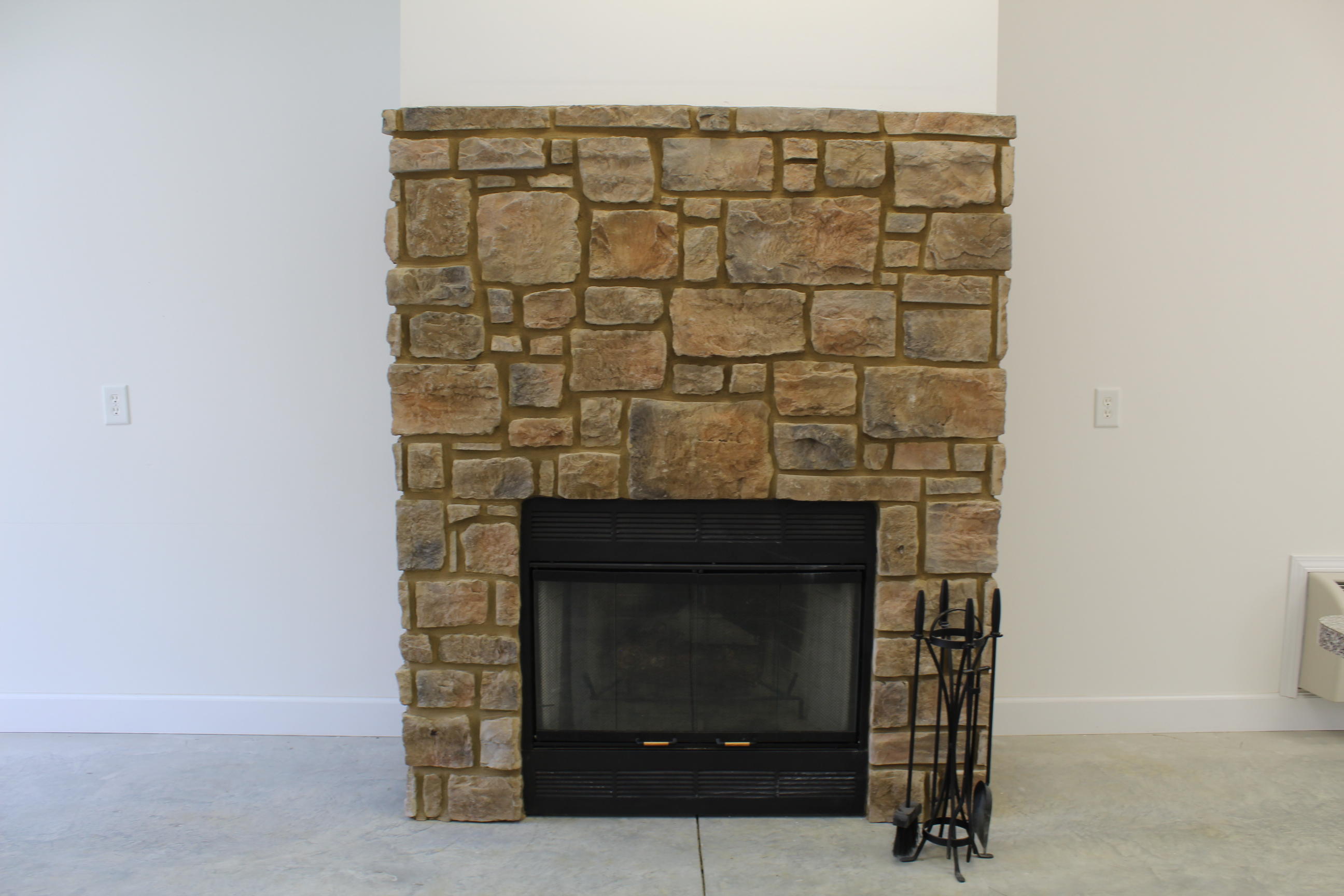 911 Goosepond Road Monterey, TN 38574 - Photo 22 of 25 Wood fireplace in detached garage