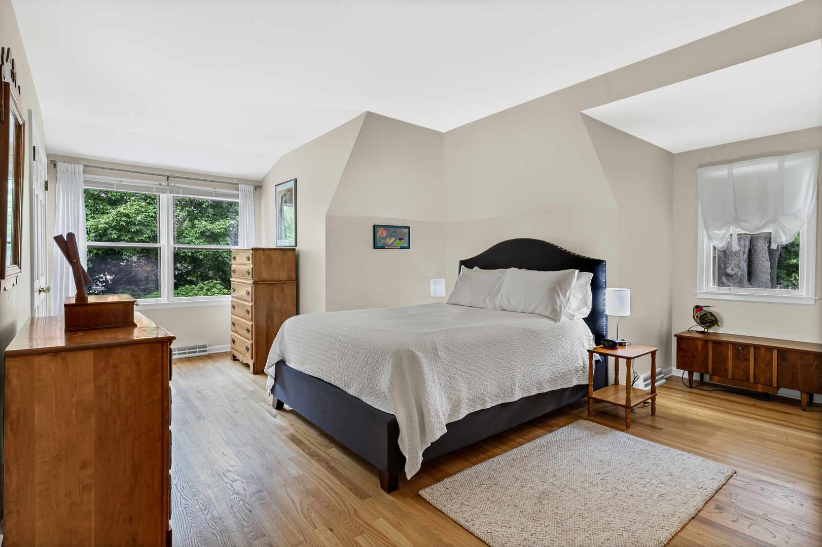 290 Cold Spring Road Barrington, IL 60010 - Photo 22 of 35 a bedroom with a bed and wooden floor
