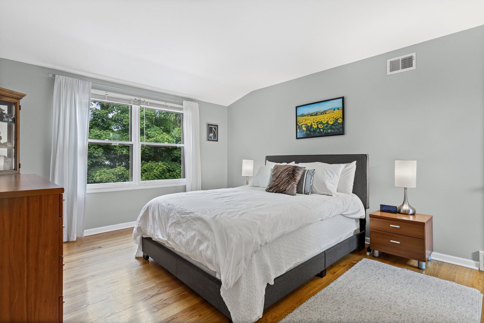 290 Cold Spring Road Barrington, IL 60010 - Photo 24 of 35 a bedroom with a bed and a painting on the wall