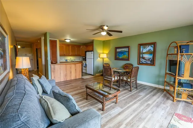 a view of a livingroom with furniture and a flat screen tv