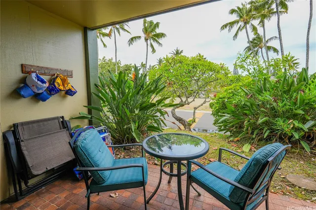 a view of a lake with lawn chairs