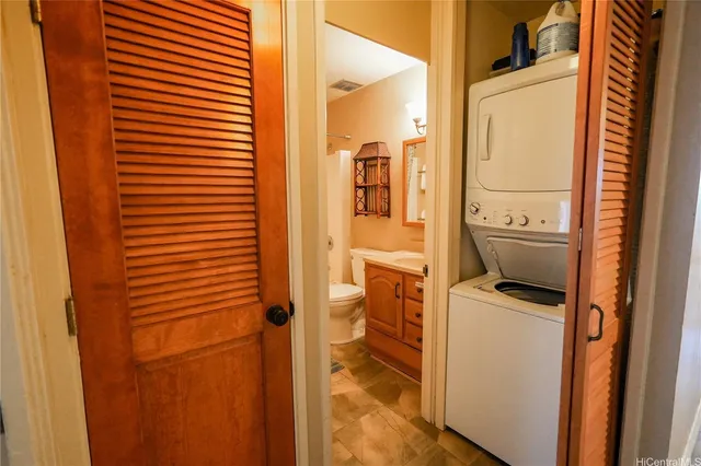 a kitchen with refrigerator cabinets and wooden floor