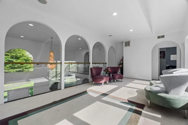 a lobby with furniture and a floor to ceiling window