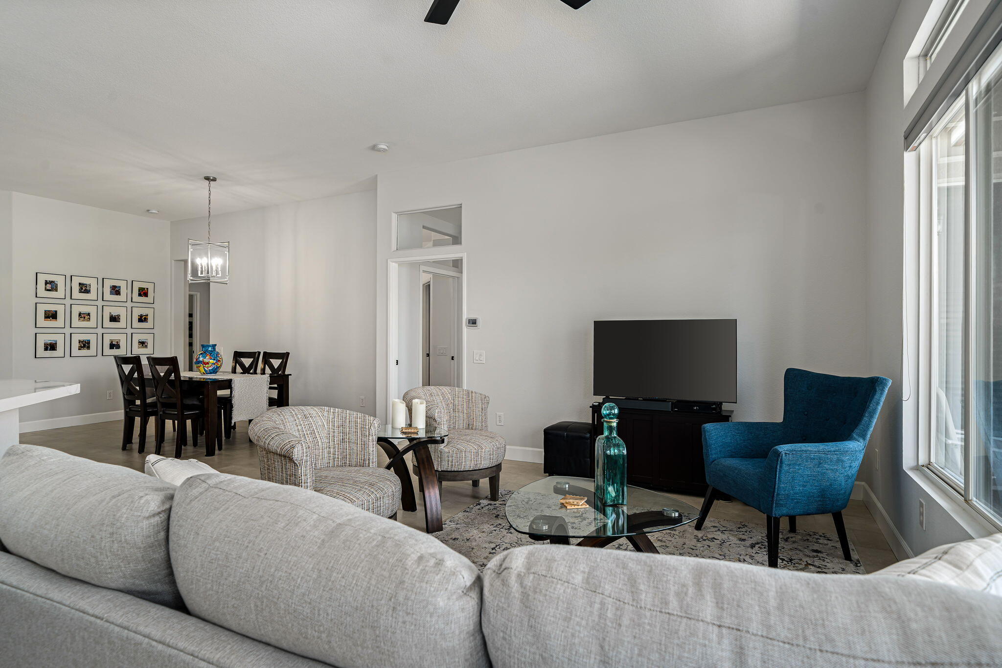 80418 Portobello Drive Indio, CA 92201 - Photo 18 of 51 a living room with furniture and a flat screen tv