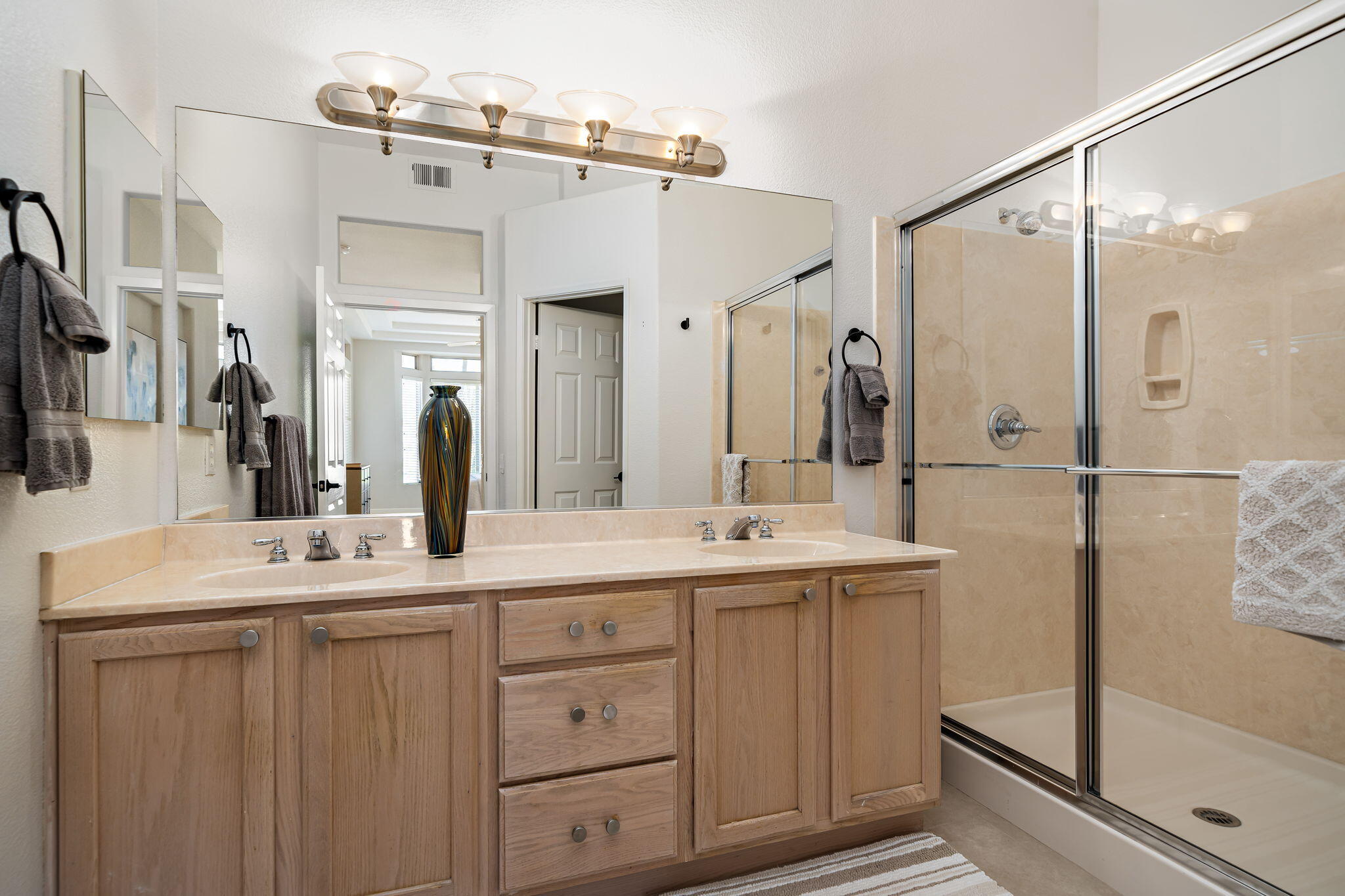 80418 Portobello Drive Indio, CA 92201 - Photo 22 of 51 a bathroom with a double vanity sink mirror and double