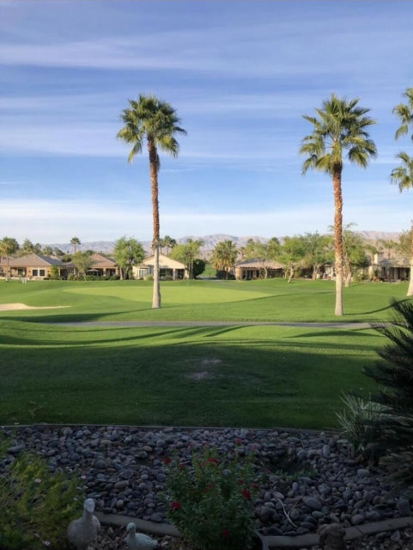 80418 Portobello Drive Indio, CA 92201 - Photo 38 of 51 a view of a golf course with a garden