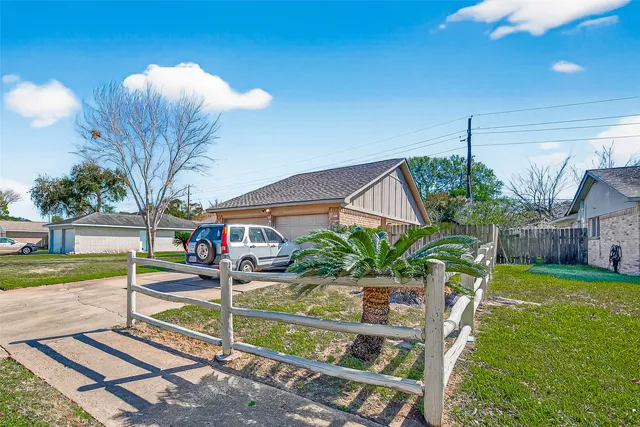 a house view with a backyard space