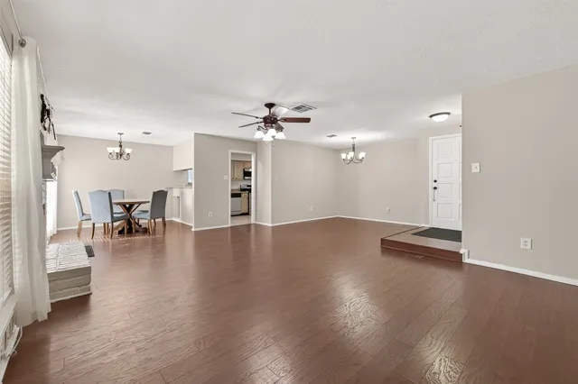 a view of livingroom with hardwood floor and a ceiling fan