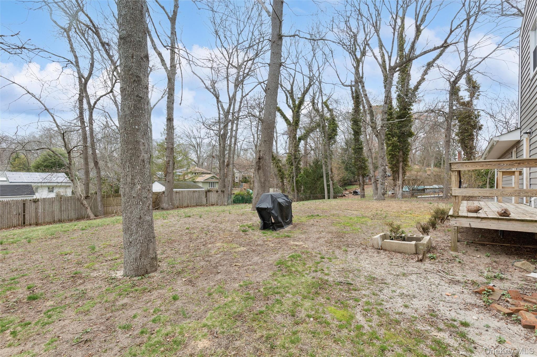 49 Overhill Road Wading River, NY 11792 - Photo 27 of 27 a view of a yard with trees