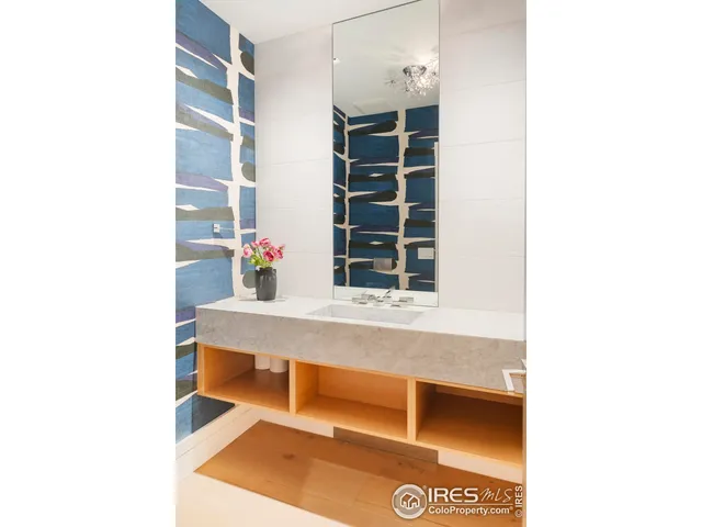 a view of living room with cabinets and window