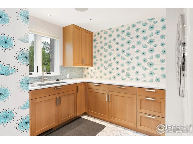 a kitchen with a cabinets and window