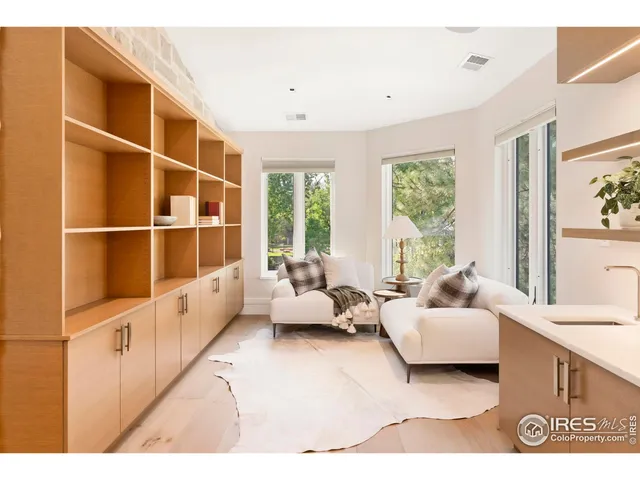 a living room with furniture window and a large window