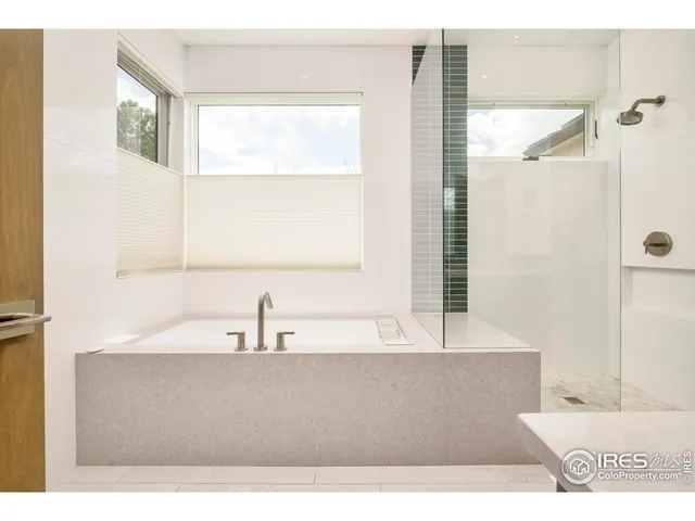 a bathroom with a bathtub and a sink