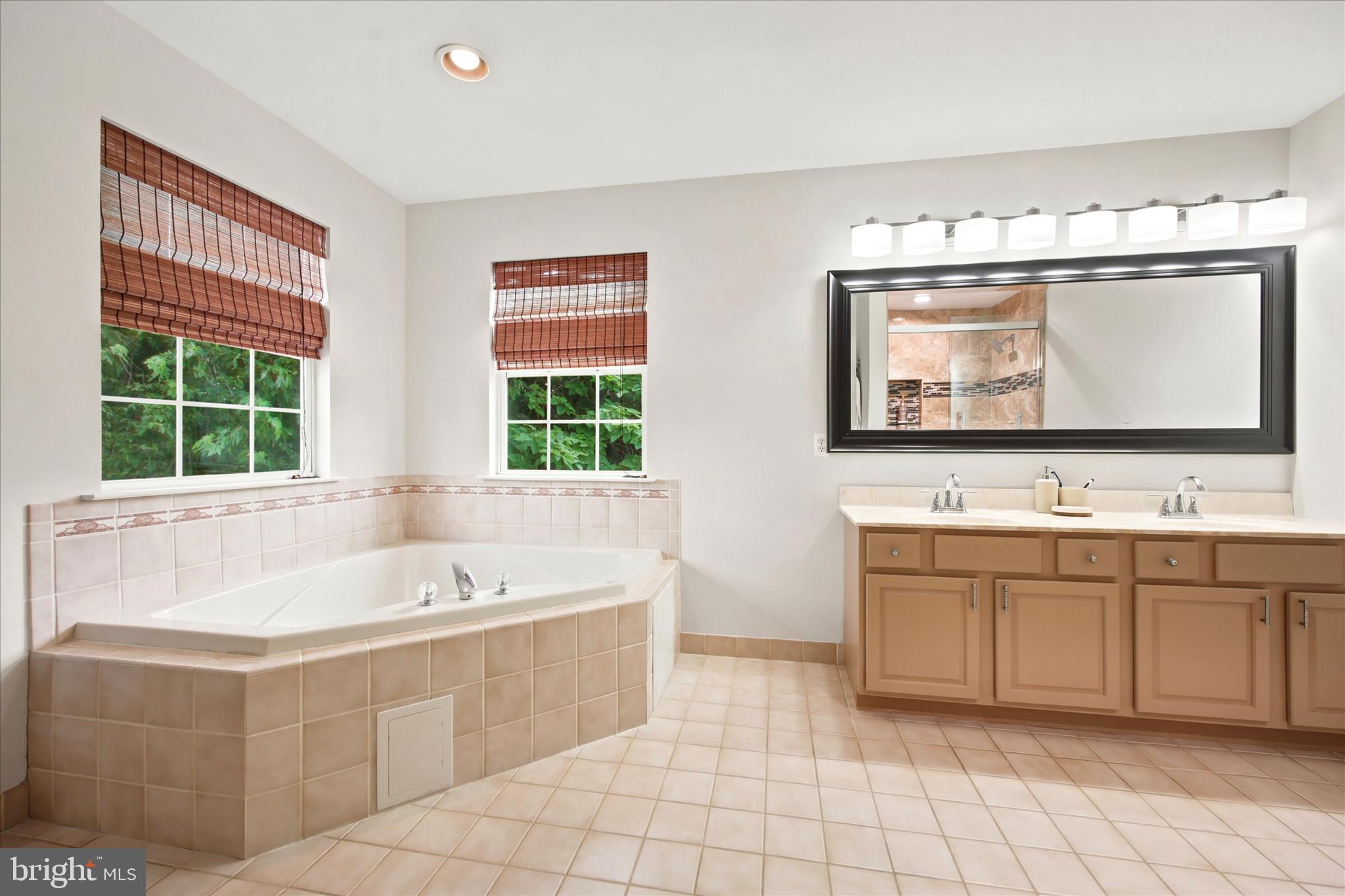 1734 East Butler Pike Ambler, PA 19002 - Photo 26 of 35 Primary Bath with double vanity and soaking tub
