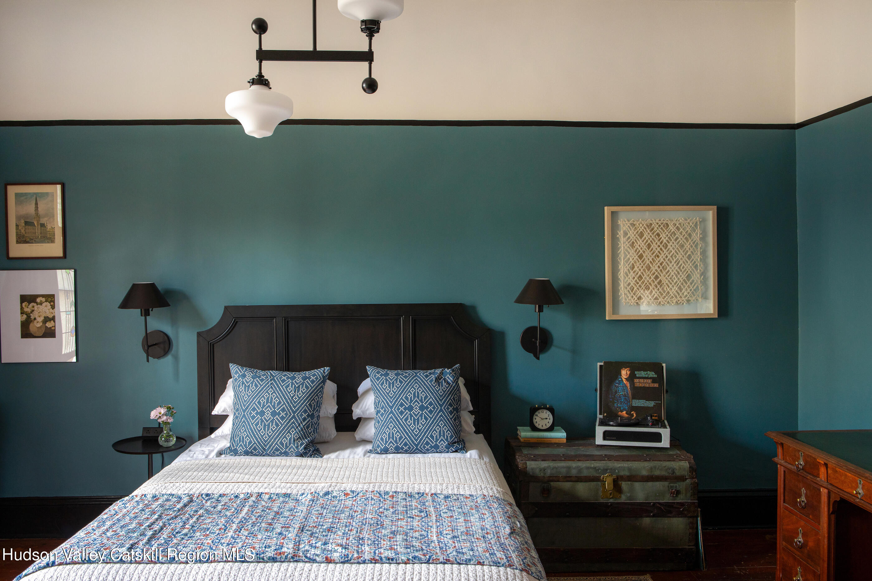 164 River Street Middleburgh, NY 12122 - Photo 27 of 48 a bed sitting in a bedroom next to a lamp