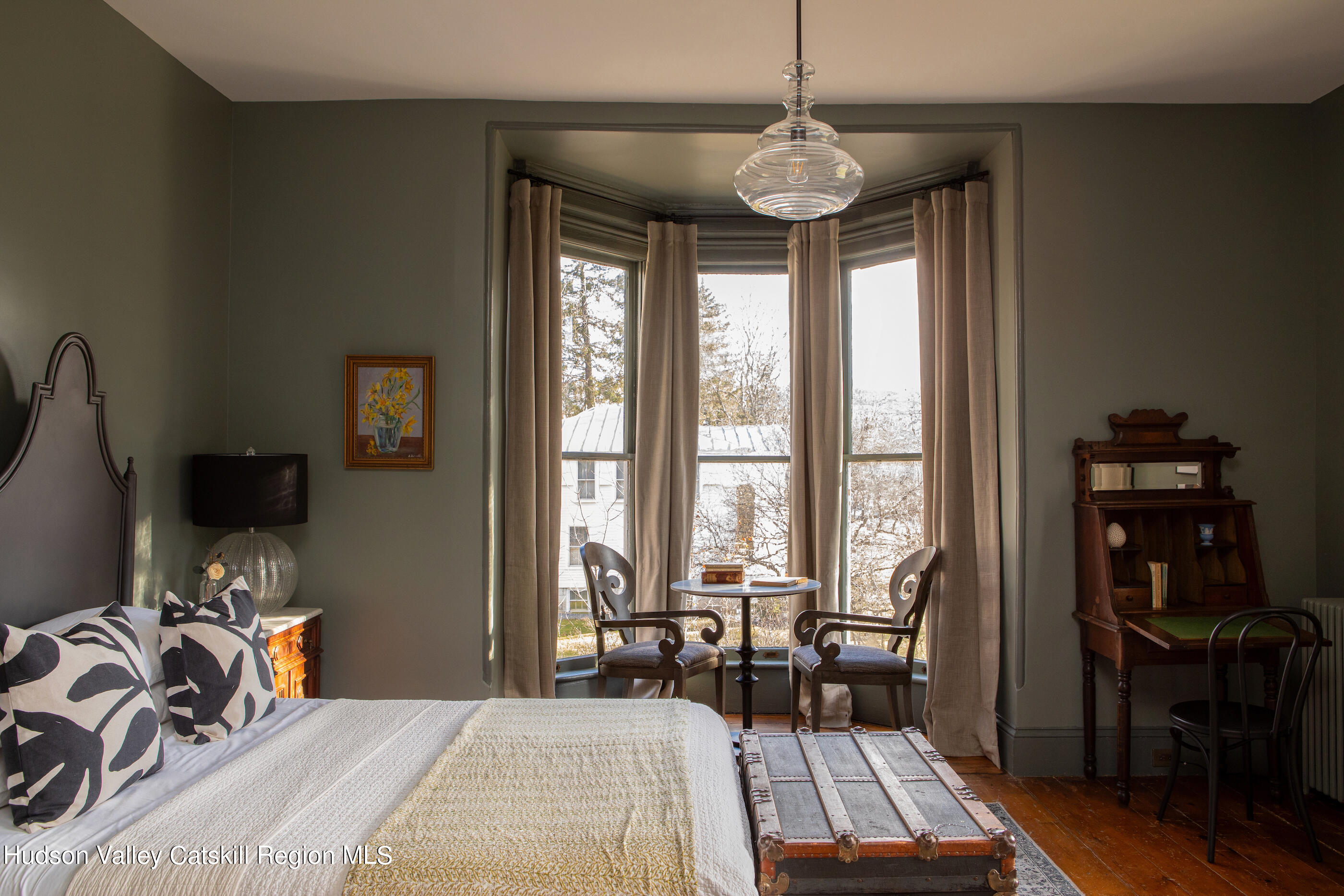 164 River Street Middleburgh, NY 12122 - Photo 31 of 48 a bedroom with a bed and a chandelier