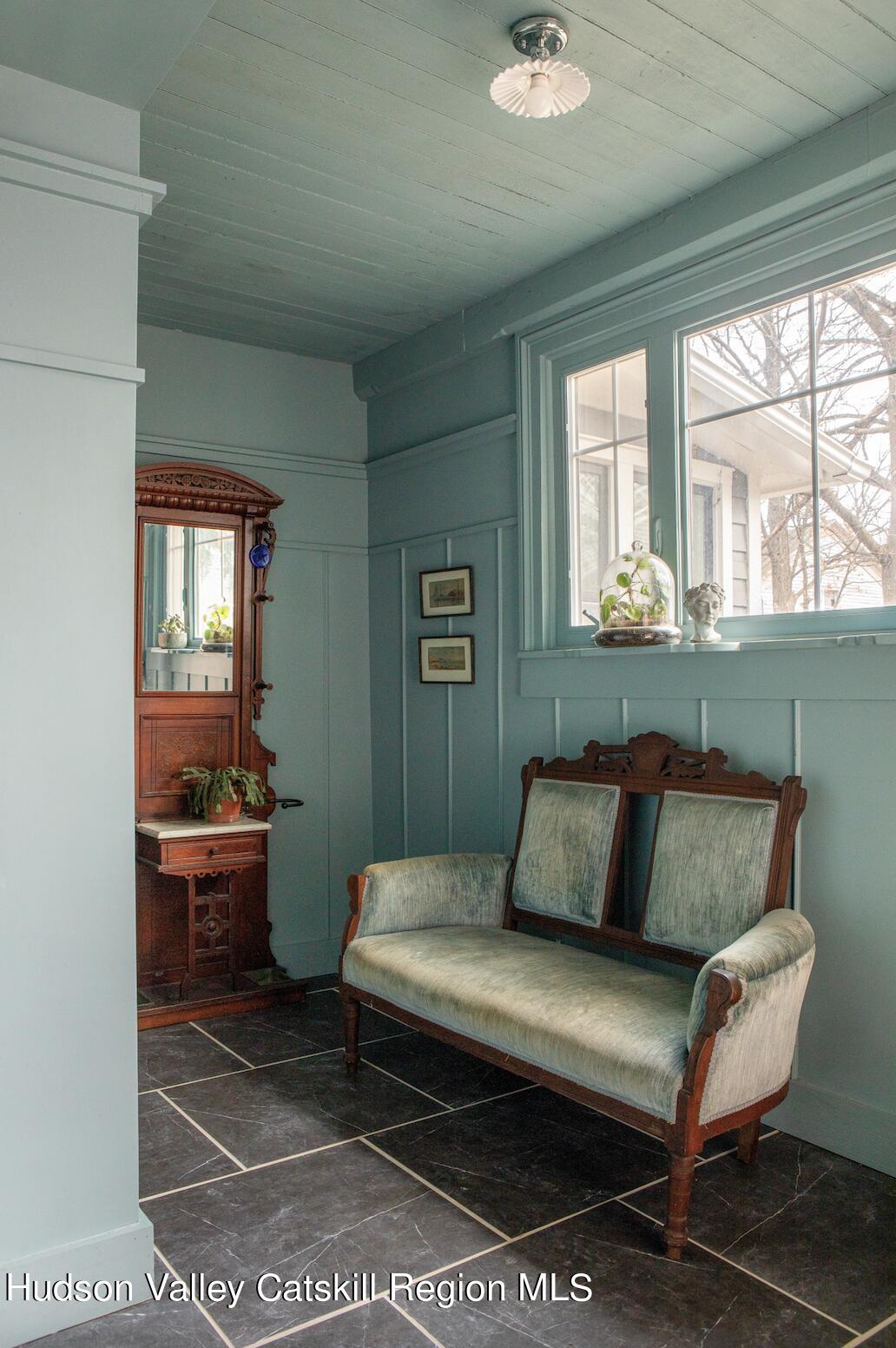 164 River Street Middleburgh, NY 12122 - Photo 35 of 48 a bedroom with a bed and wooden floor