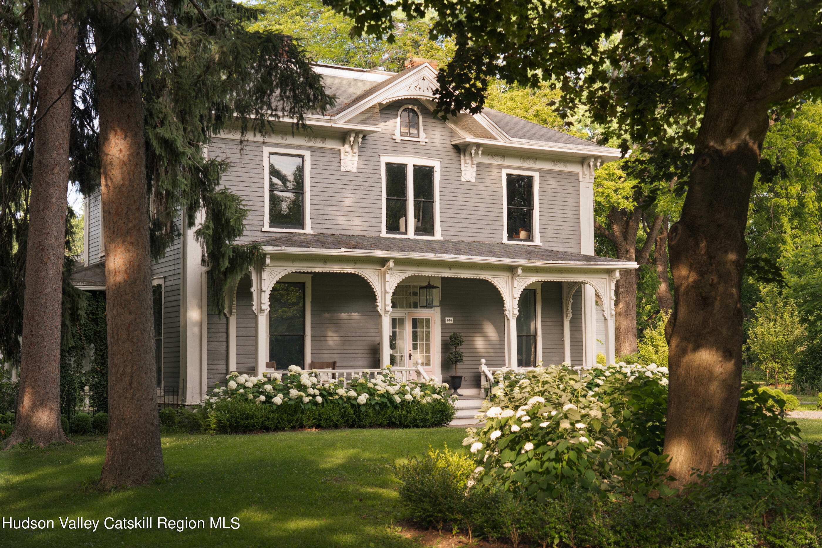 164 River Street Middleburgh, NY 12122 - Photo 38 of 48 a front view of a house with a garden