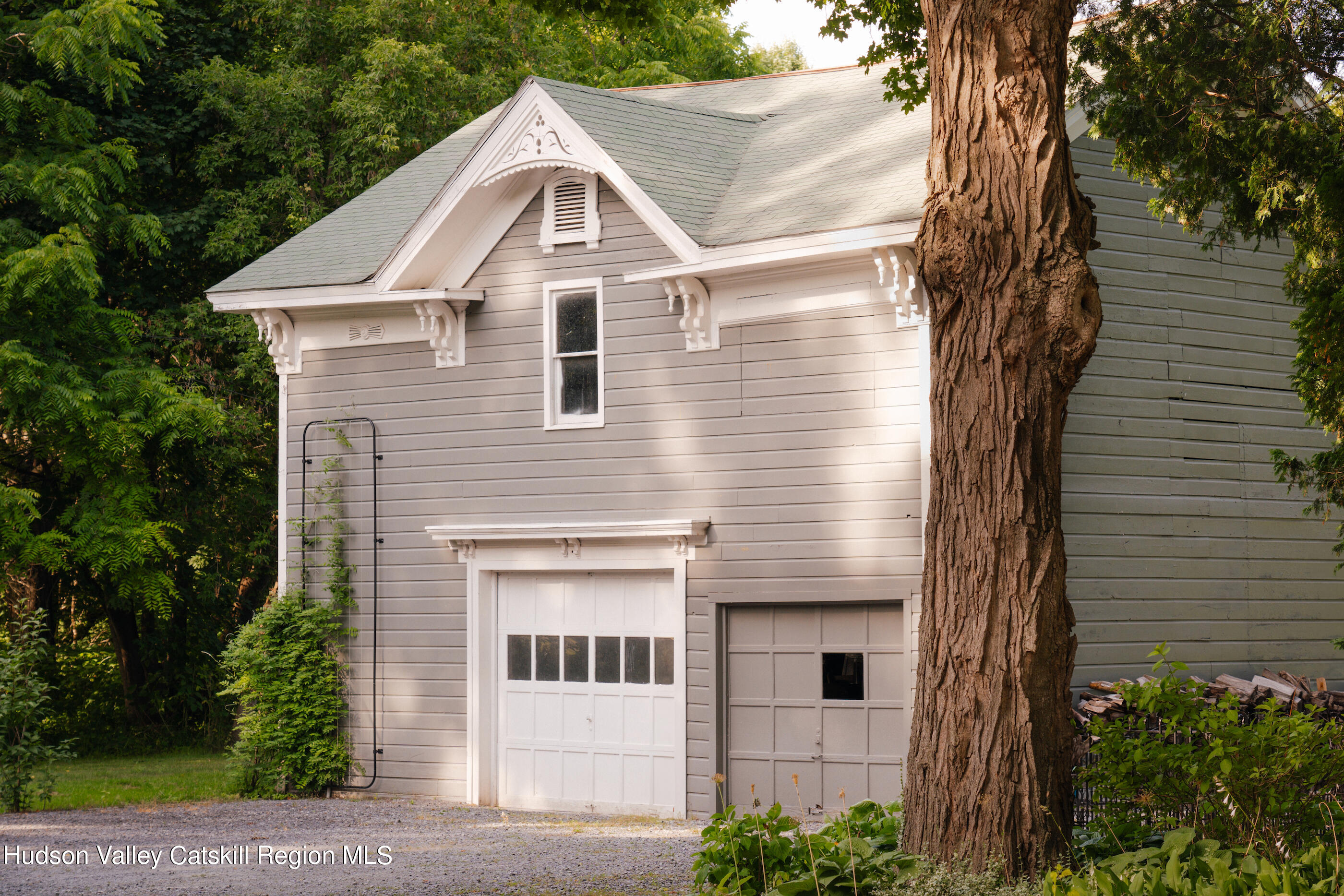 164 River Street Middleburgh, NY 12122 - Photo 4 of 48 a front view of a house with a tree