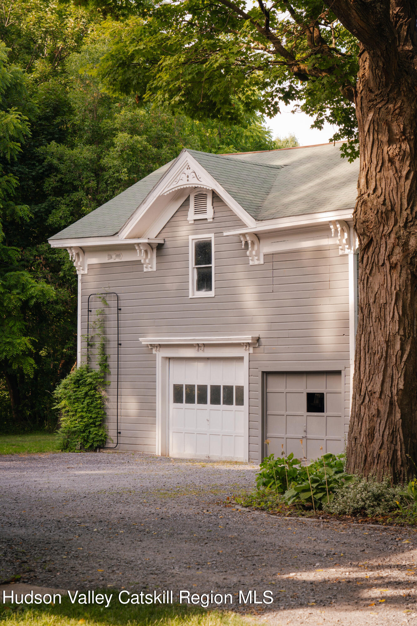 164 River Street Middleburgh, NY 12122 - Photo 43 of 48 a front view of a house with a yard and garage