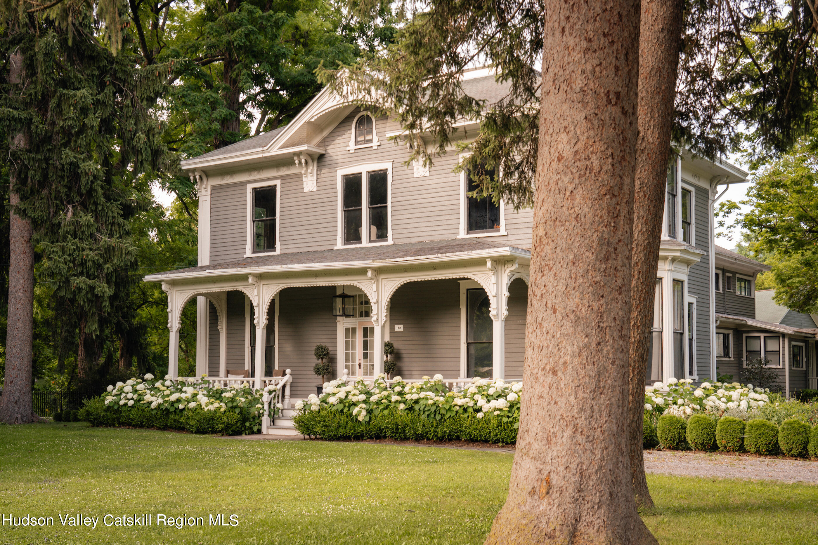 164 River Street Middleburgh, NY 12122 - Photo 48 of 48 a front view of a house with a garden and plants