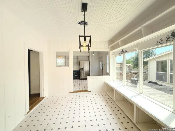 a kitchen with a sink a stove and cabinets