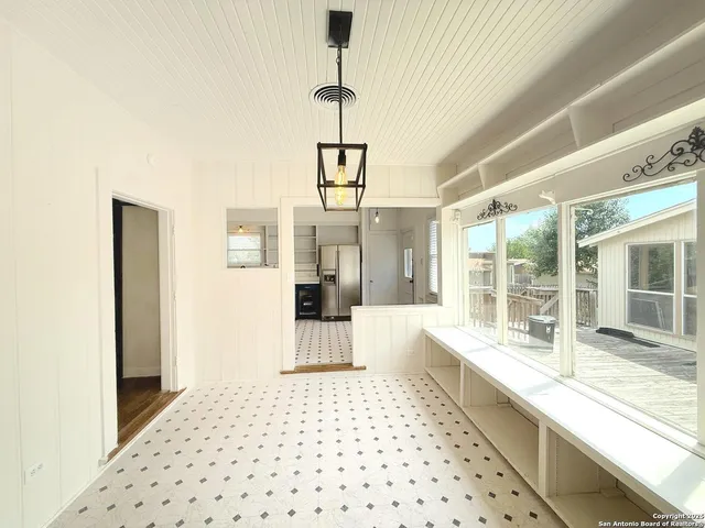 a kitchen with a sink a stove and cabinets