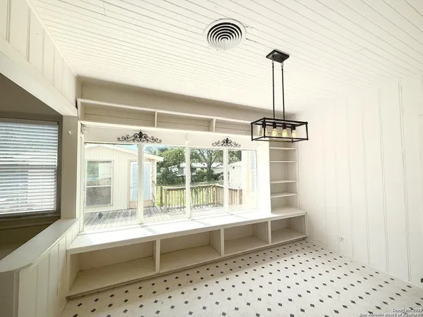 a room with a sink and a large window