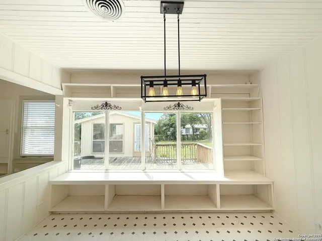 a bathroom with a double vanity sink and mirror