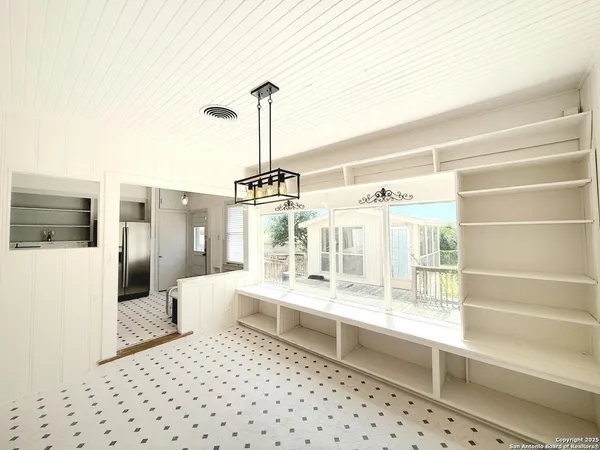 a bedroom with furniture and window