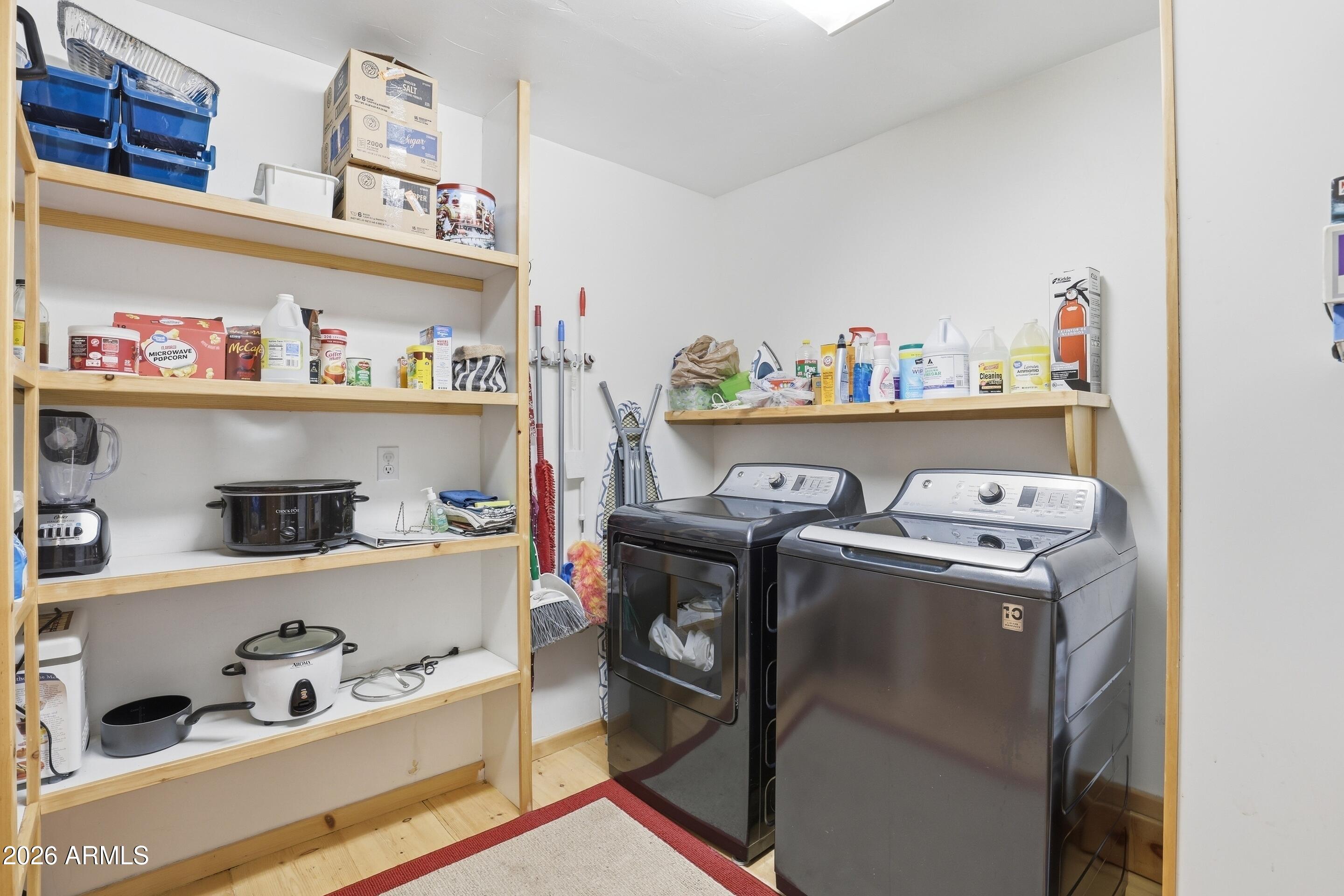 6322 Sharyn Road Pine, AZ 85544 - Photo 12 of 37 a utility room with multiple dryer and washer