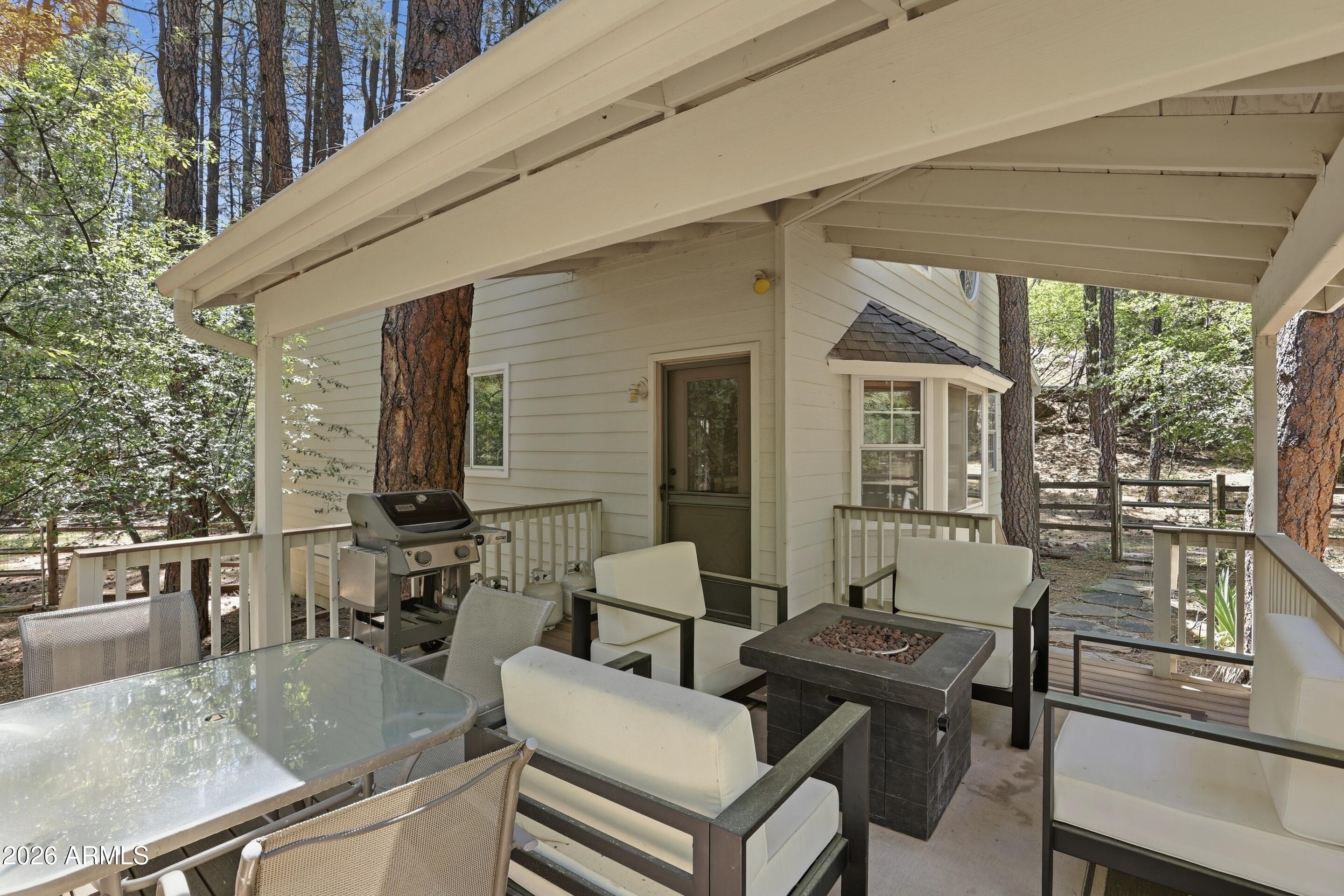 6322 Sharyn Road Pine, AZ 85544 - Photo 14 of 37 a view of a patio with table and chairs and potted plants