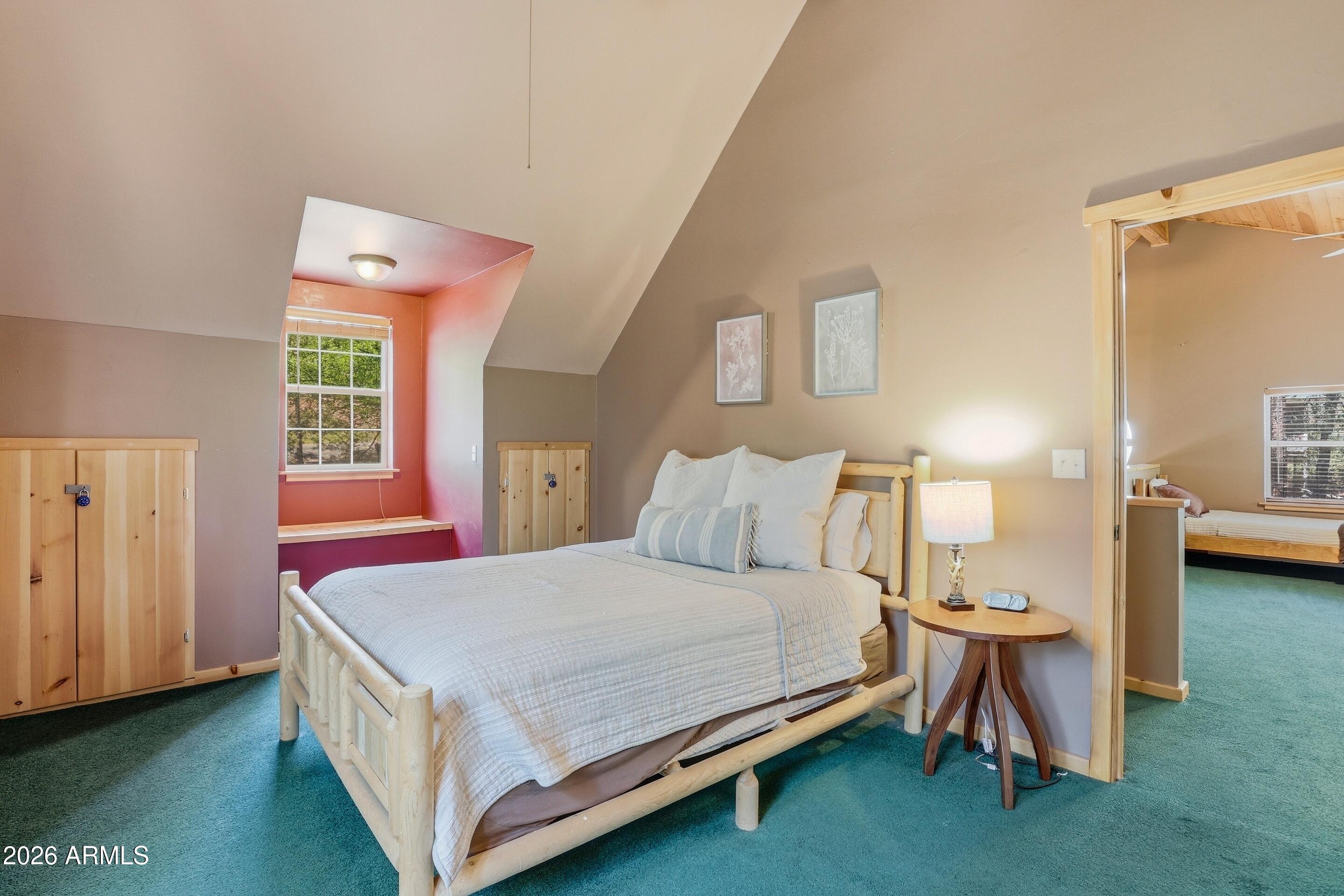 6322 Sharyn Road Pine, AZ 85544 - Photo 25 of 37 a bedroom with a bed and a table in it