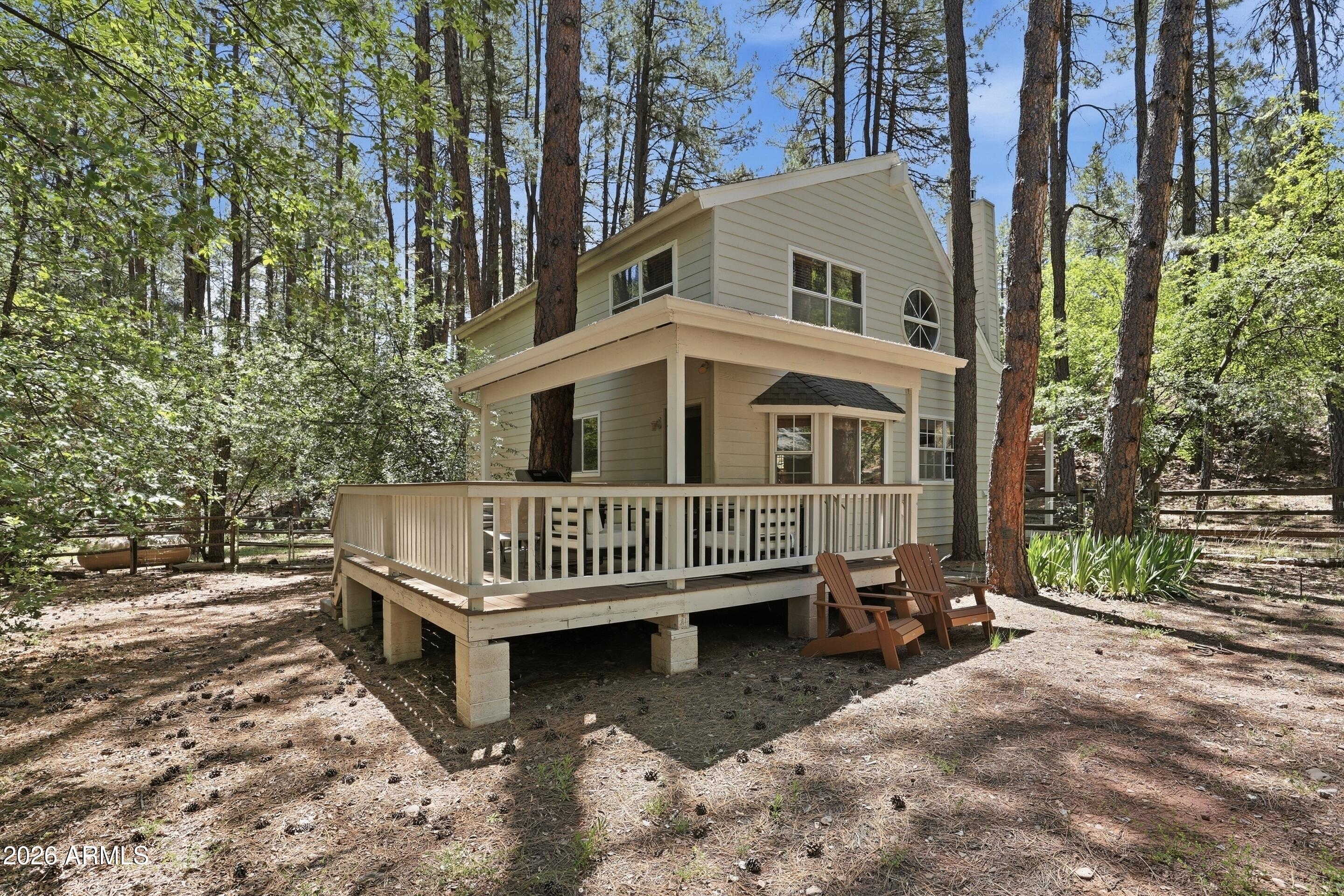 6322 Sharyn Road Pine, AZ 85544 - Photo 27 of 37 a view of a house with a yard and deck