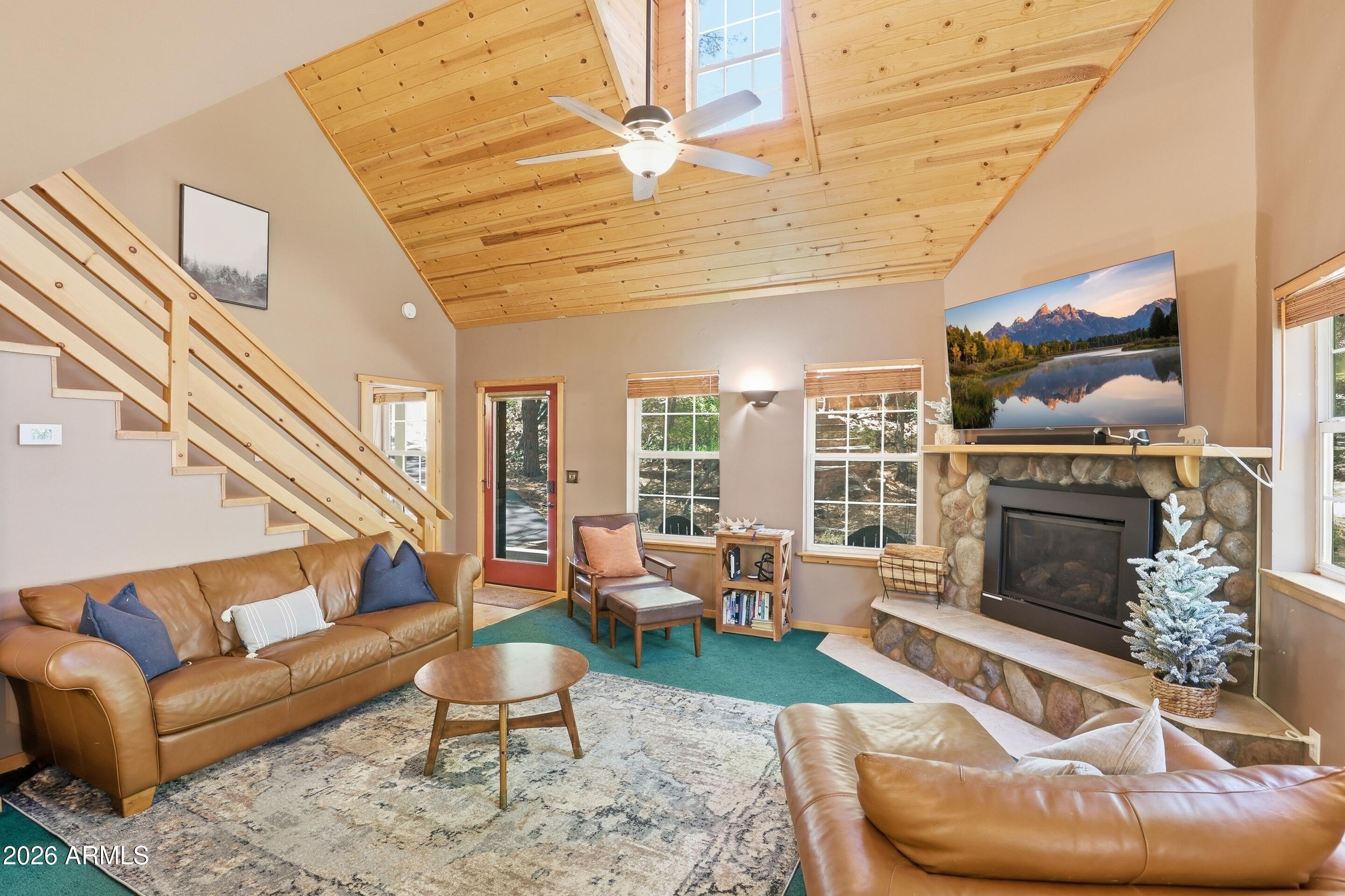 6322 Sharyn Road Pine, AZ 85544 - Photo 6 of 37 a living room with furniture and a fireplace
