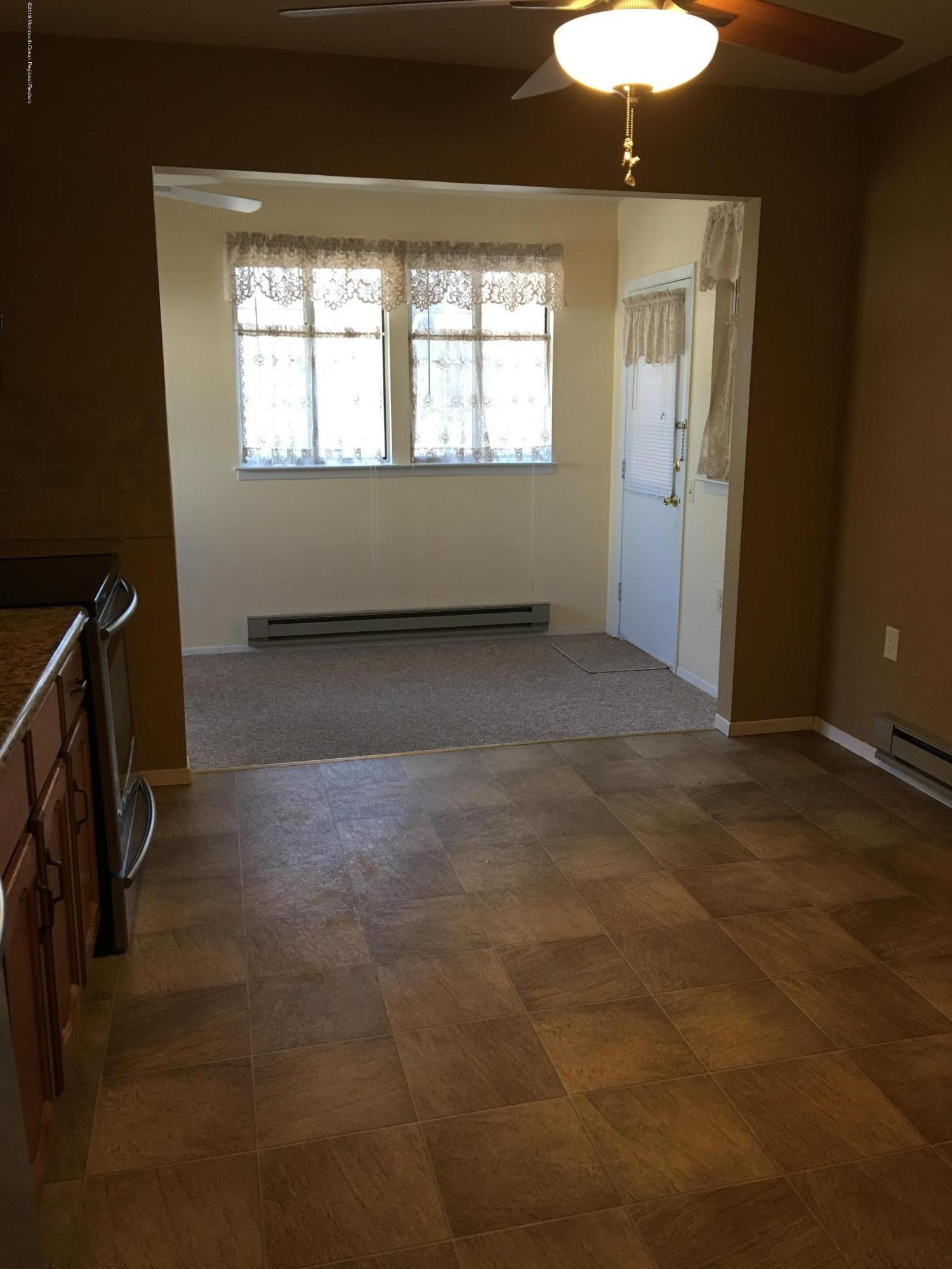 34 Berkshire Road, Unit 65 Whiting, NJ 08759 - Photo 12 of 16 kitchen into den
