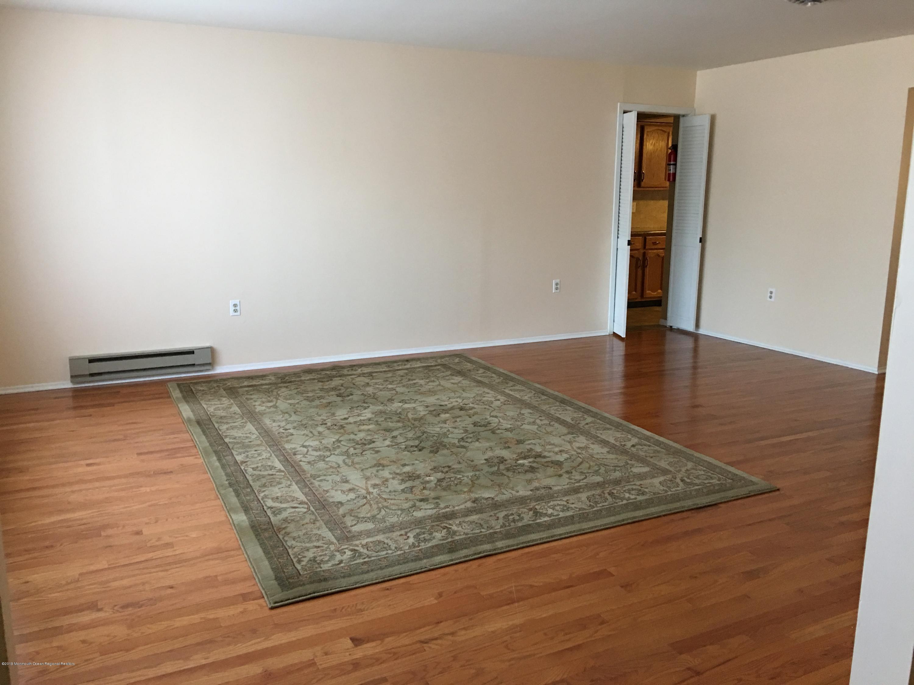 34 Berkshire Road, Unit 65 Whiting, NJ 08759 - Photo 7 of 16 living room into kitchen